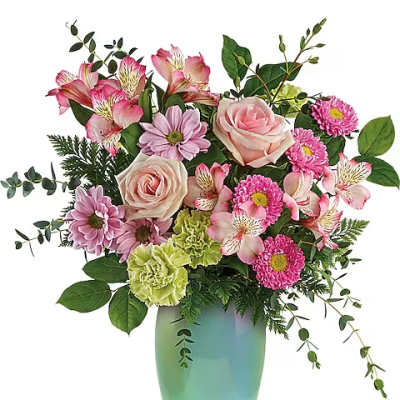 Pink and lavender mixed bouquet in a green glass vase