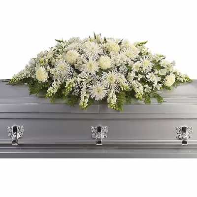 White floral casket spray with mixed blooms