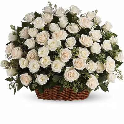 White roses arranged in a wicker basket