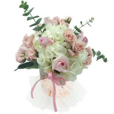 Bouquet of pale pink roses and white hydrangeas with a pink ribbon