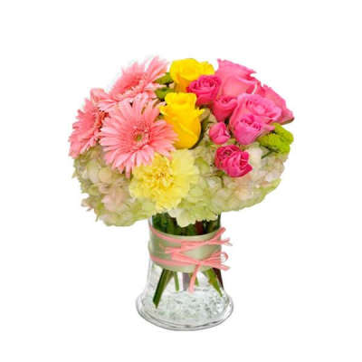 Pink and yellow mixed bouquet in a glass vase with ribbon