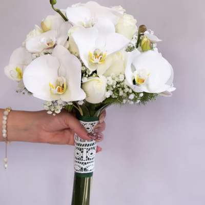 White orchid bouquet with lace-wrapped handle
