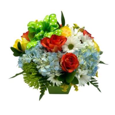Bouquet of roses, hydrangeas, and daisies with a green polka-dot bow