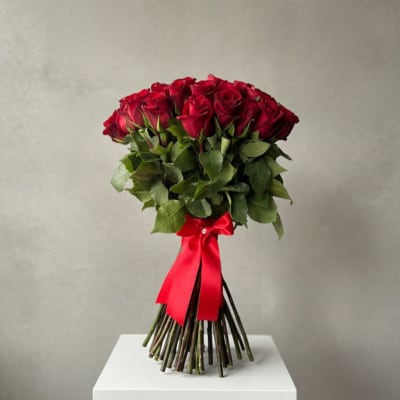 Bouquet of red roses tied with a red ribbon