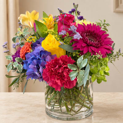 Colorful mixed bouquet in a clear glass vase