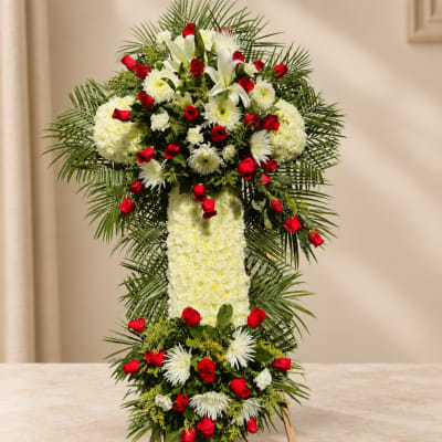 Standing floral cross with red roses and white flowers