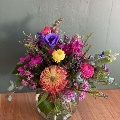 Colorful mixed bouquet in a clear glass vase