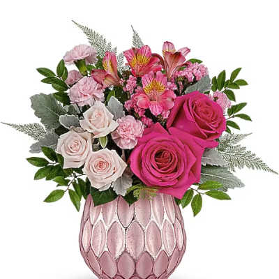 Pink and white rose bouquet in a textured pink vase
