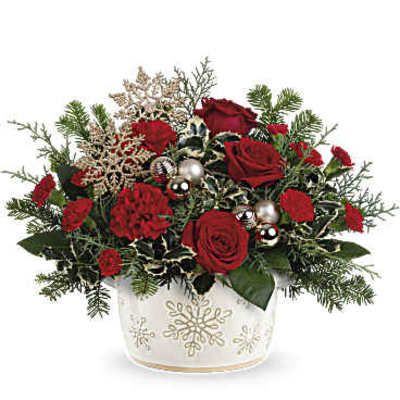 Red roses in a white snowflake-decorated container
