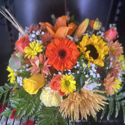 Mixed bouquet with sunflowers, roses, and gerbera daisies
