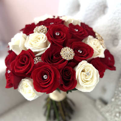 Bouquet of red and white roses with jeweled accents