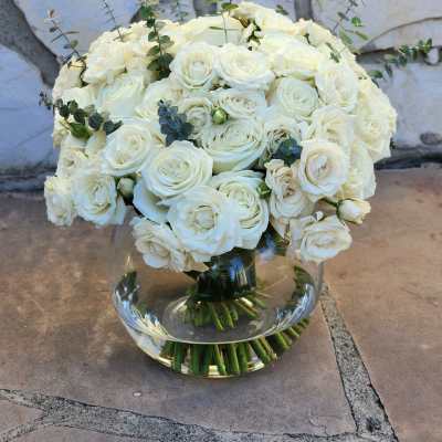White rose bouquet in a clear glass vase