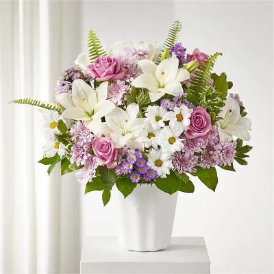 Pink and white mixed bouquet in a white vase
