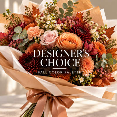 Fall bouquet with roses, carnations, and daisies wrapped in paper