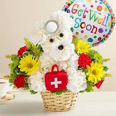 White flower dog arrangement in a basket with a get well balloon