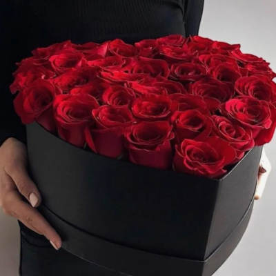 Heart-shaped box filled with red roses