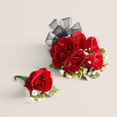 Red rose boutonniere and matching wrist corsage with black ribbon