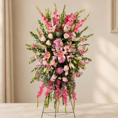 Tall pink floral standing arrangement with lilies and roses