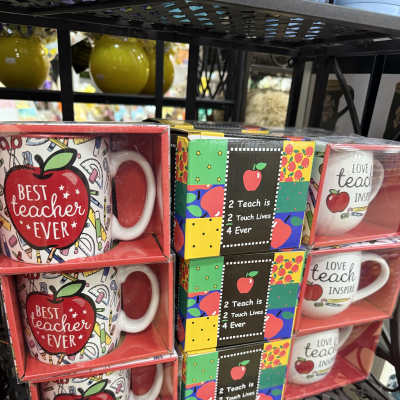 Gift mugs with teacher-themed designs in boxed sets