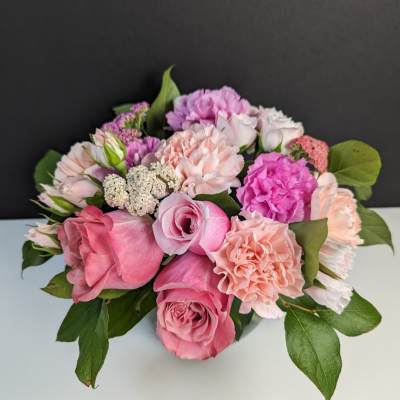 Pink and peach rose bouquet with carnations and small filler flowers