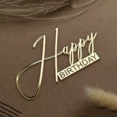 Gold "Happy Birthday" topper on brown background