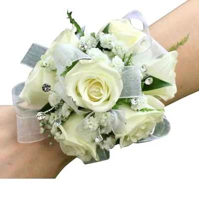 White rose wrist corsage with ribbon and rhinestone accents