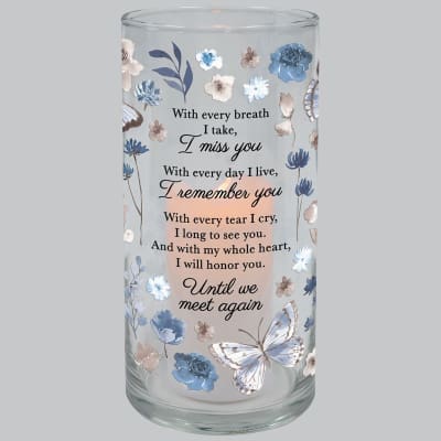 Glass cylinder candle holder with blue and beige floral and butterfly design and memorial text