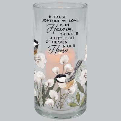 Glass cylinder candle holder with birds, white flowers, and a memorial quote.
