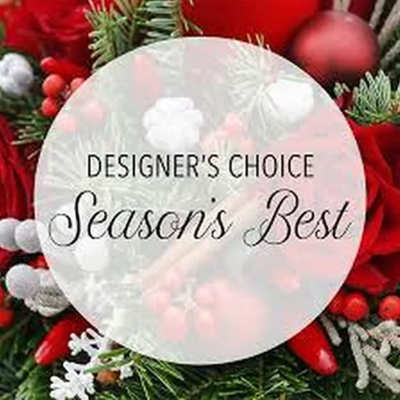 Holiday wreath with red ornaments and a "Season's Best" sign