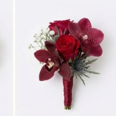 Red rose and orchid boutonniere with burgundy wrap