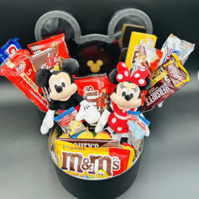 Mickey and Minnie plush toys in a black gift box with assorted candy