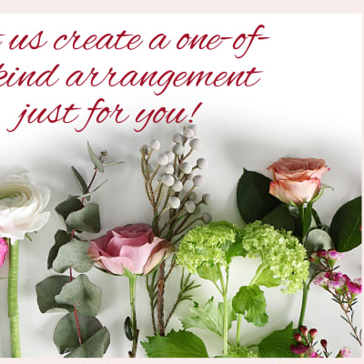 Assorted roses and greenery arranged beneath red script text.