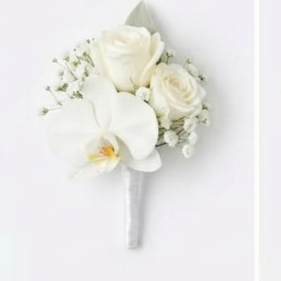 White bridal bouquet with roses and an orchid bloom