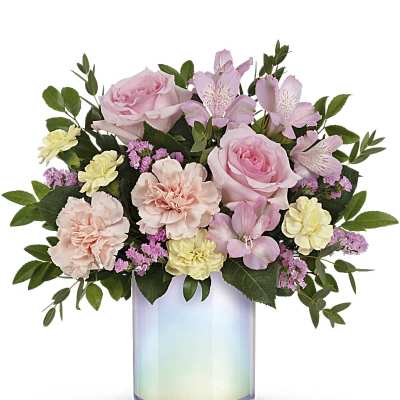 Pink roses and carnations in an iridescent glass vase