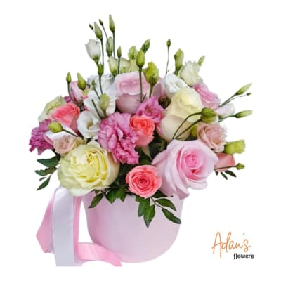 Pink and white rose bouquet in a pastel pink hatbox with ribbon
