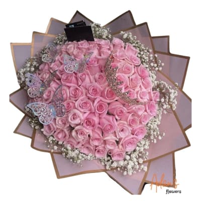 Large bouquet of pink roses with baby’s breath and butterfly decorations