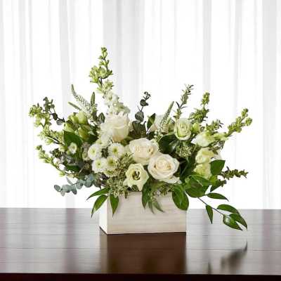 White floral arrangement in a rectangular white box