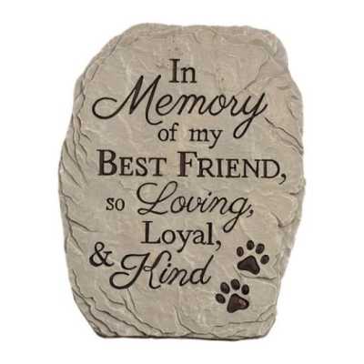 Pet memorial stone plaque with engraved tribute text and paw prints.