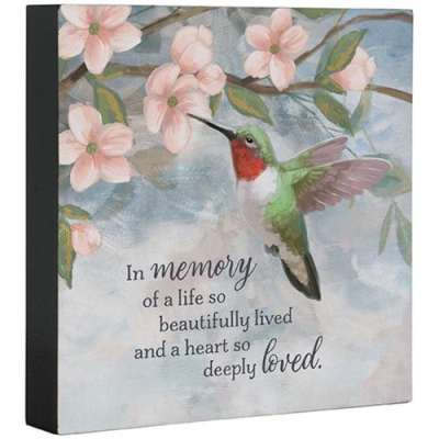 Memorial plaque with hummingbird and pink blossoms with an in-memory quote.