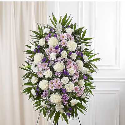 Standing floral spray of white, pink, and purple flowers on an easel