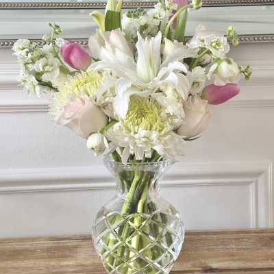 Pink and white mixed bouquet in a clear glass vase