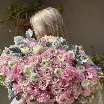 Large bouquet of pink and white roses with ruffled pink flowers