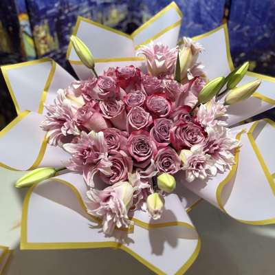 Pink rose bouquet with lilies wrapped in white paper