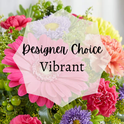 Bright mixed bouquet with pink gerbera daisy, carnations, and other colorful blooms with Designer Choice Vibrant text
