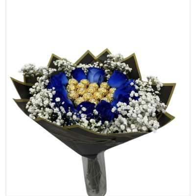 Blue roses with white baby's breath and gold-wrapped chocolates in black wrap