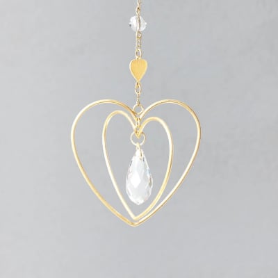Gold wire double-heart hanging ornament with clear teardrop crystal and bead on a chain