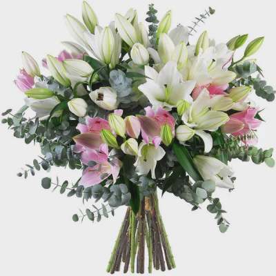 Bouquet of white and pink lilies with eucalyptus