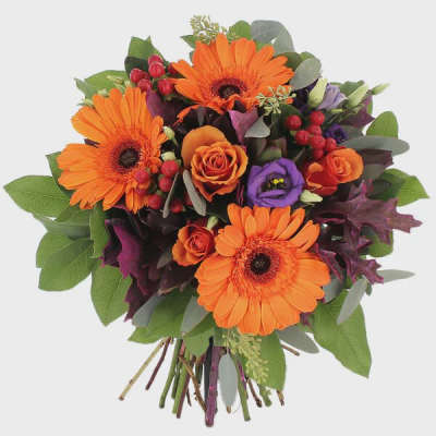 Bouquet of orange gerbera daisies and roses with purple blooms