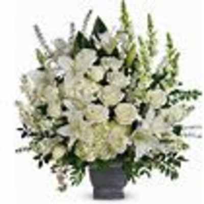 White floral arrangement in a dark vase
