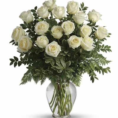 Bouquet of white roses in a clear glass vase